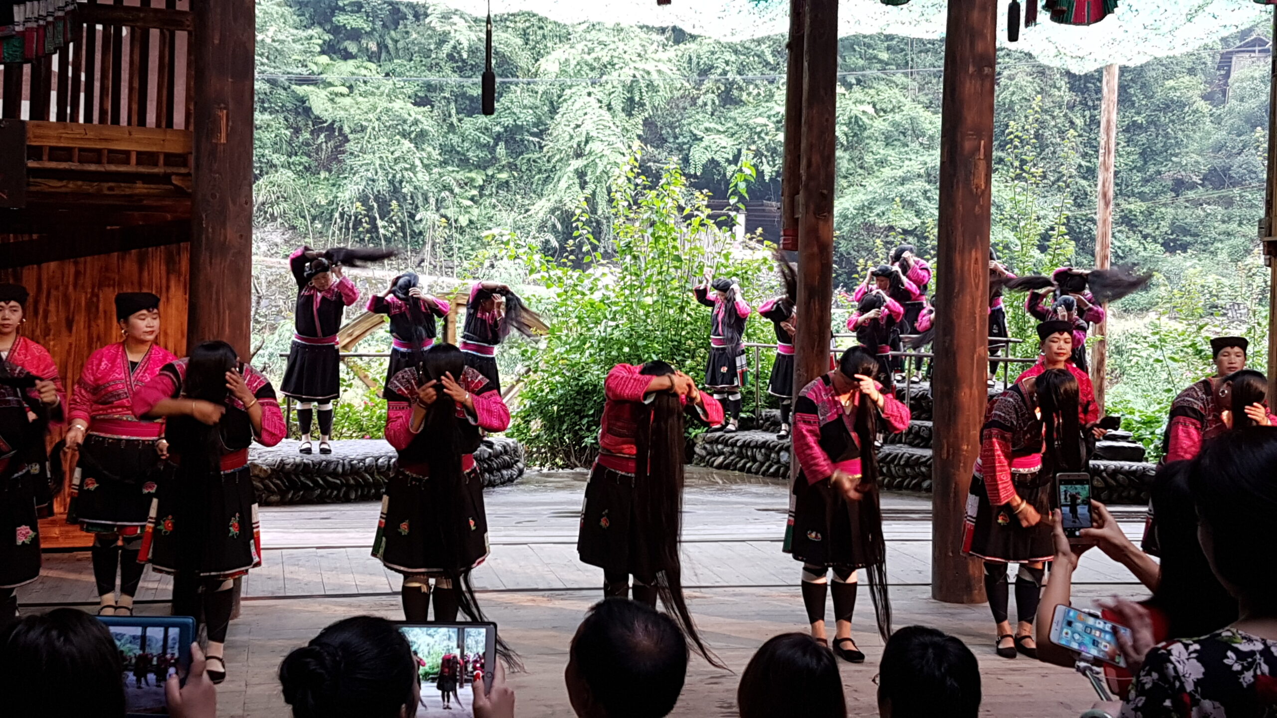 Yao women showing their long hair during a performance at Longji.