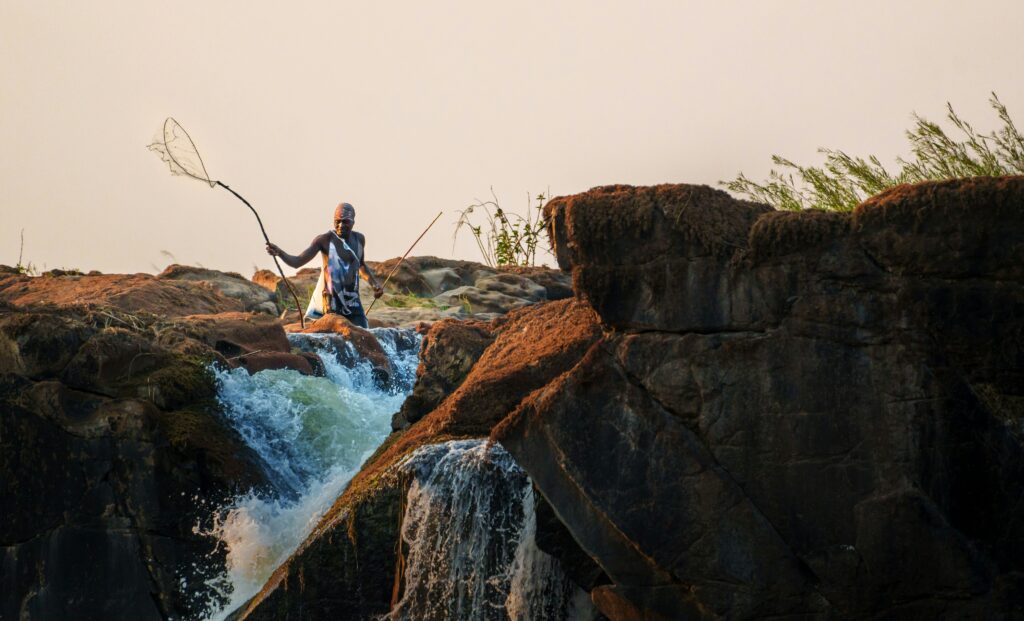 Indigenous people showing how to fish